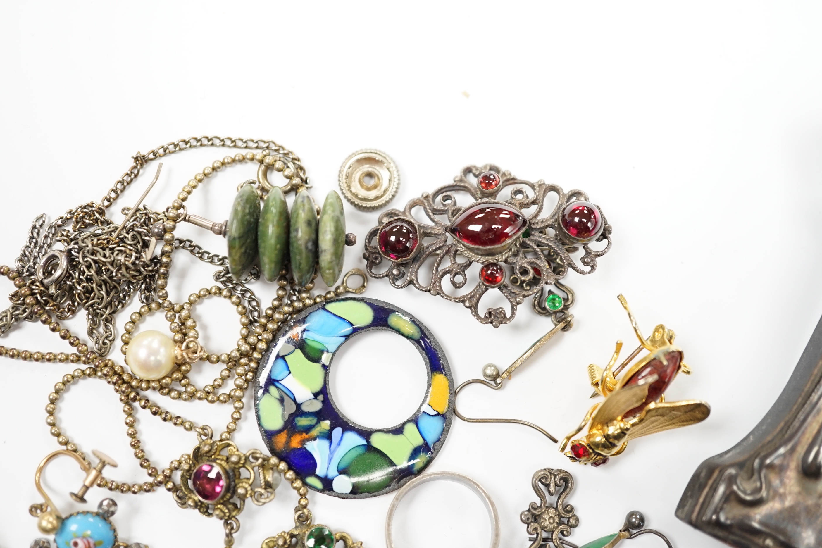 An Art Nouveau style sterling and enamelled double photograph frame, width 11.3cm, together with sundry jewellery including an Austro-Hungarian style necklace, white metal and cabochon amethyst set ring(stamped silver) e